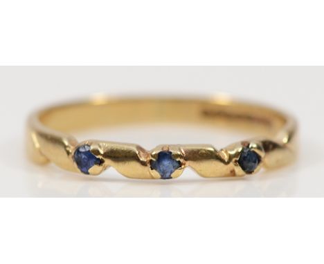 A 9ct gold sapphire three stone ring, L, 1.1g