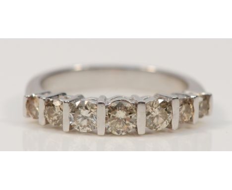 A platinum brilliant cut diamond seven stone dress ring, champagne coloured brilliant cut diamonds, N, estimated 90pts, 5.6g