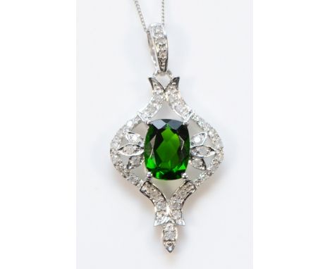 A 9ct white gold diopside and brilliant cut diamond pendant with a chain, 30mm, 2.3g