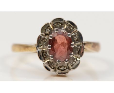 A 9ct gold ruby and diamond cluster ring, Birmingham 1991, P, 2.7g