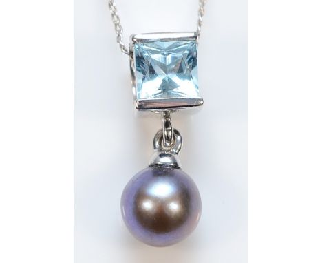 A 9ct white gold blue topaz and cultured pearl pendant on a chain, 2.5g