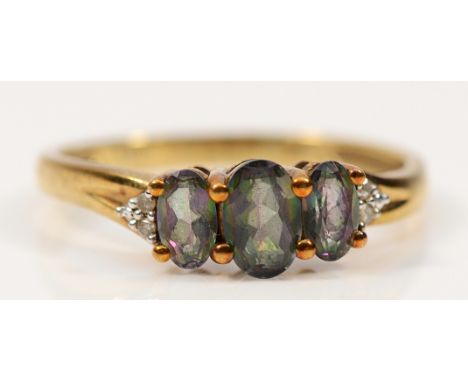 A 9ct gold mystic topaz three stone ring with diamond set shoulders, P, 1.8g