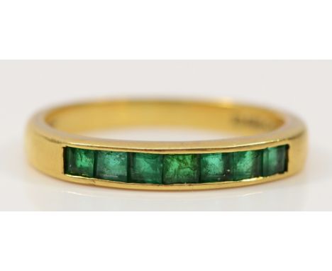 An 18ct gold emerald half eternity ring, London 1991, M 1/2, 3.1g