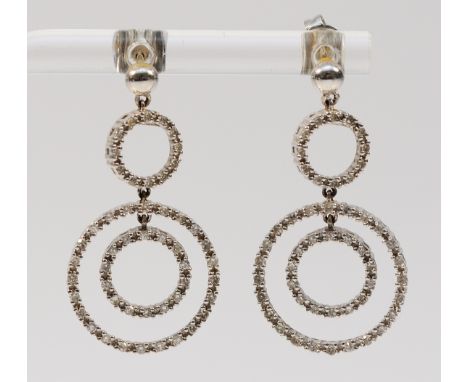 A pair of 9ct white gold diamond drop earrings with scroll backs, 32mm drop, 5g