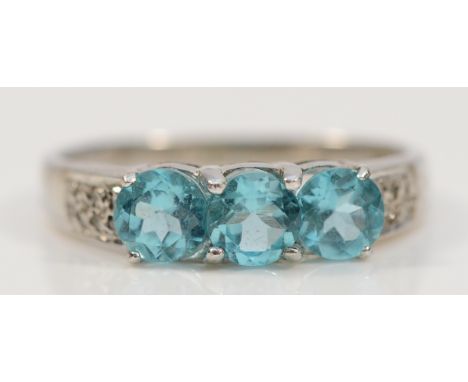 A 14K white gold blue gemstone three stone ring, M, possibly blue zircon, 1.3g