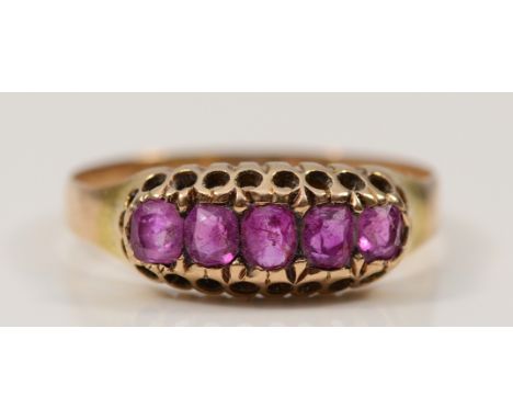 A 15ct gold ruby five stone ring, Birmingham 1921, L 1/2, 1.6g