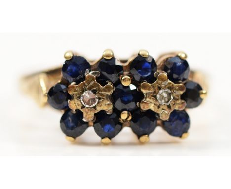 A 9ct gold sapphire and diamond cluster ring, London 1975, M 1/2, 2.6g