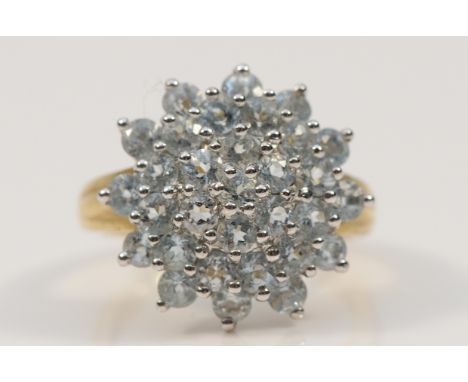 A QVC 9ct gold pale blue gemstone cluster ring, 17mm across, L, 3.5g