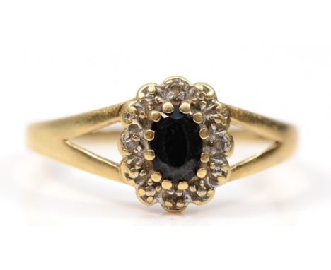 A 9ct gold sapphire and diamond cluster ring, R 1/2, 1.8g