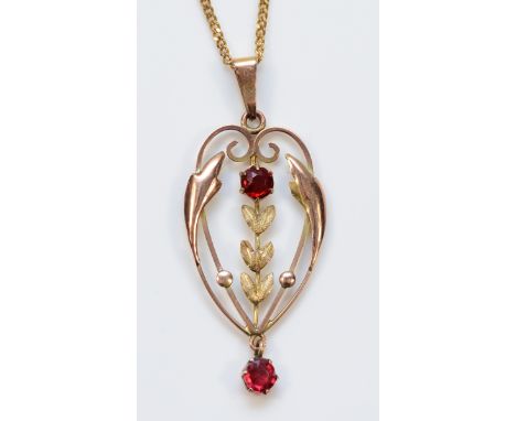 An Edwardian gold garnet pendant with a 9ct gold chain, 35mm, 3g