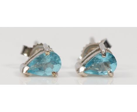 A pair of 14K white gold blue gemstone earrings with scroll backs, possibly blue topaz, 1.1g