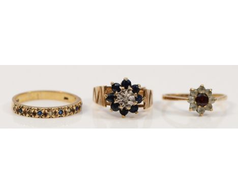 A 9ct gold garnet and paste cluster ring, M, a blue and white paste half eternity ring, P, and a sapphire and diamond cluster