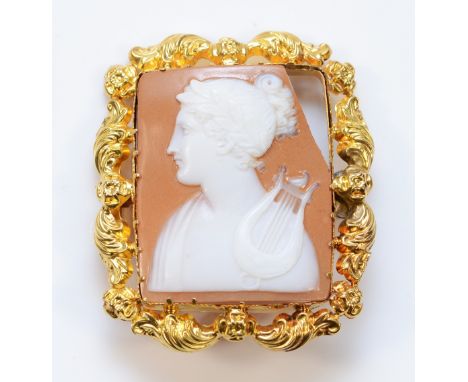 A unmarked gold mounted shell cameo brooch, 40mm x 35mm, corner of cameo missing, 8.8g