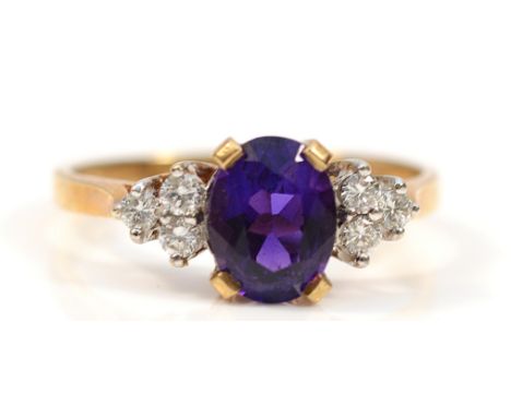 A 9ct gold diamond and amethyst dress ring, London 1988, N, 2.4g