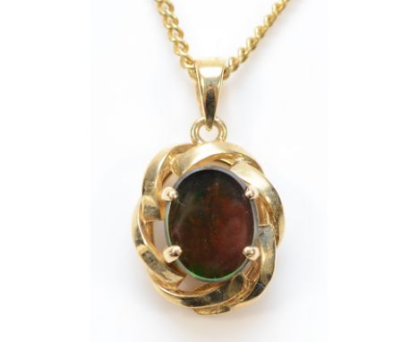 A 14K gold Korite pendant with a chain, 4.6g