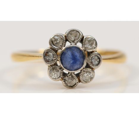 An 18ct gold sapphire and single cut diamond cluster ring, some damage to the diamonds, M 1/2, 2.1g