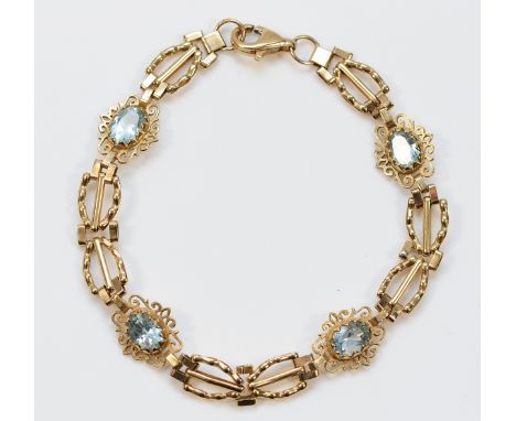 A 9ct gold blue topaz bracelet, 18cm, 6g
