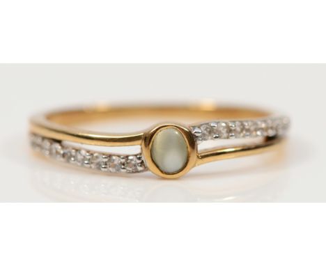A 9ct gold cats eye chrysoberyl and white gemstone dress ring, P 1/2, 2.1g