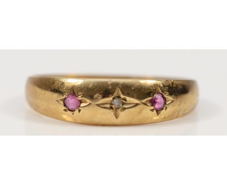 A 9ct gold ruby and diamond three stone ring, Birmingham 1991, P, 1.6g