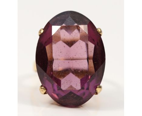 A 9ct gold purple paste cocktail ring, 25mm x 18mm, O, 10.1g