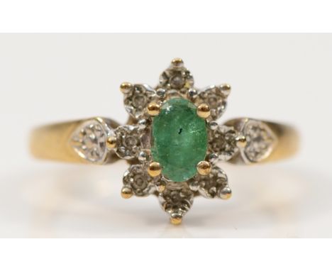 A 9ct gold diamond and emerald cluster ring, L, 2.7g
