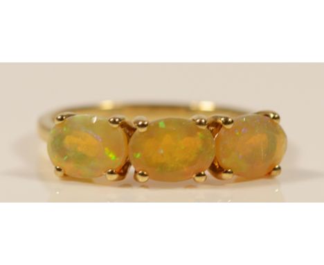 A 9ct gold fire opal three stone ring, N, 2g