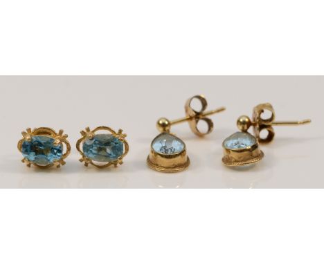 A pair of 9ct gold aquamarine earrings with scroll backs, together with a pair of 9ct gold blue topaz earrings with scroll ba