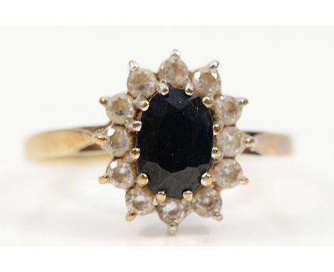 A 9ct gold blue and white sapphire cluster ring, M, 1.7g