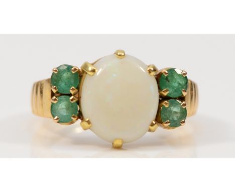 An unmarked 14K gold opal and emerald dress ring, 12mm x 10mm opal, Q, 7.2g