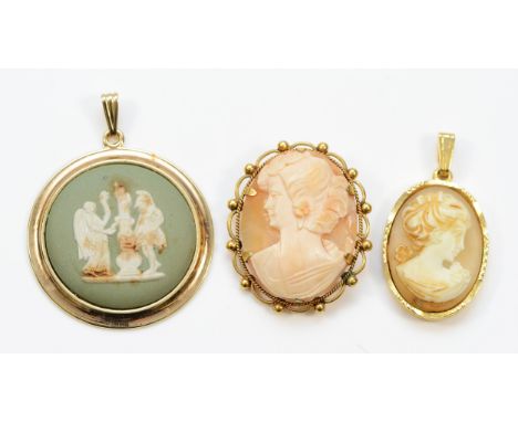 Wedgwood, an unmarked gold mounted cameo pendant, 43mm, with an unmarked gold shell cameo brooch, and another gilt metal exam