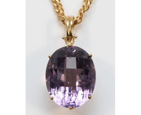 A 9ct gold mounted amethyst pendant with a 14K gold chain, chain weighs 15g, pendant weighs 10g, 25mm x 20mm amethyst