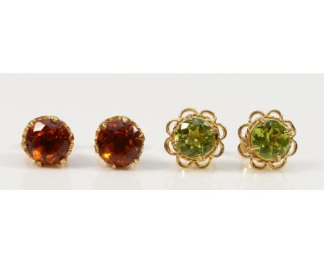 A pair of 9ct gold citrine earrings, with a pair of 9ct gold peridot earrings, both with scroll backs, 3.9g