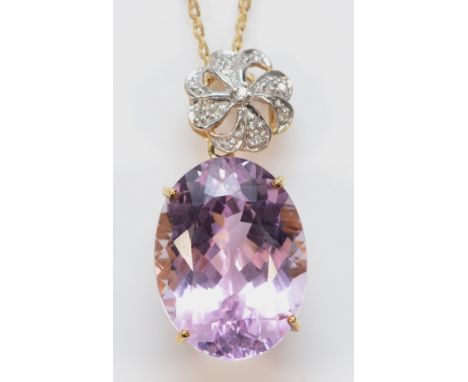 A 9ct gold amethyst and diamond pendant on a chain, 20mm x 15mm, 7.5g