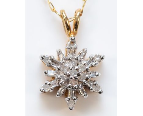 A 9ct gold vari cut diamond cluster pendant on a chain, 2.5g