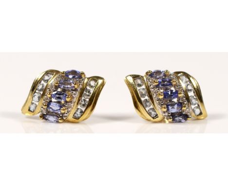A pair of 9ct gold tanzanite, topaz and diamond earrings with scroll backs, 3.2g