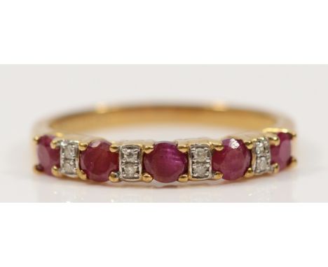A 9ct gold ruby and brilliant cut diamond half eternity ring, N, 2g