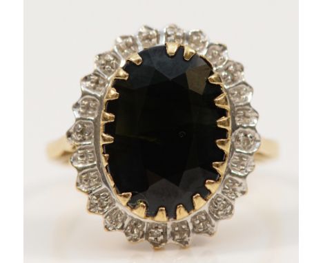 A 9ct gold sapphire and single cut diamond cluster ring, some damage to claws on the sapphire, 18mm x 10mm sapphire, N, 4.6g