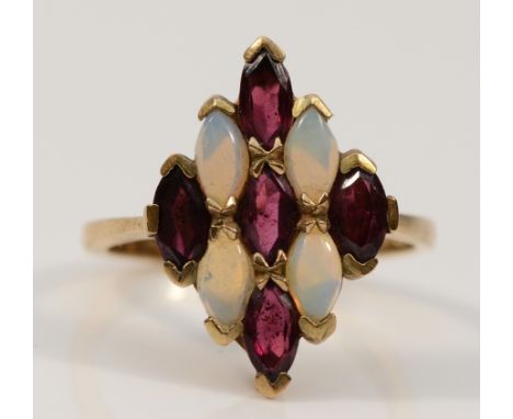 A 9ct gold opal and garnet dress ring, 20mm ring front, N 1/2, 3.3g
