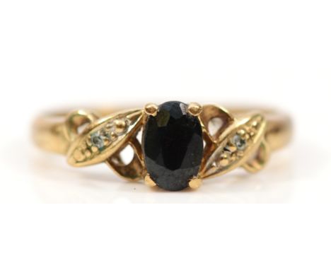 A 9ct gold sapphire and diamond cross over ring, I 1/2, hallmarks worn, 1.5g