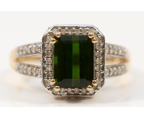 A 9ct gold green tourmaline and diamond dress ring with diamond set shoulders, S, 3.8g
