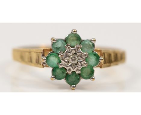A 9ct gold emerald and brilliant cut diamond cluster ring, M, 1.4g