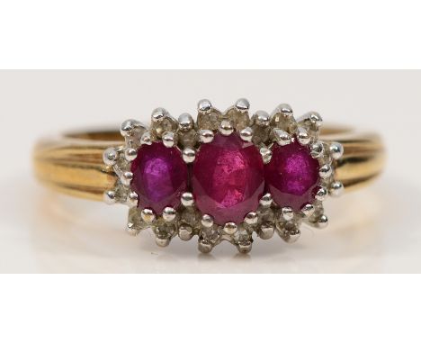 A 9ct gold ruby and diamond cluster ring, Sheffield 1998, L, 3.2g
