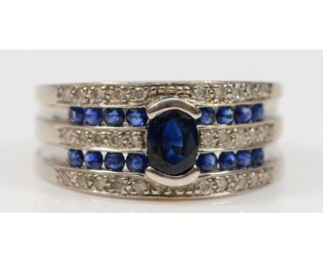 A 9ct white gold diamond and sapphire dress ring, stated 0.22ct, P, 4.3g