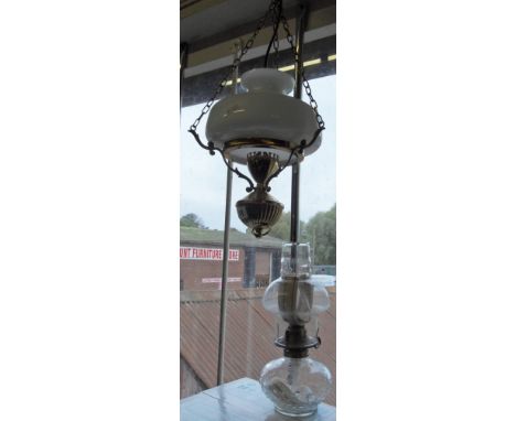 Modern brass hanging lantern and an oil lamp with glass reservoir