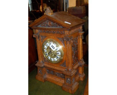Victorian carved oak mantle clock with brass dial & enamel numerals