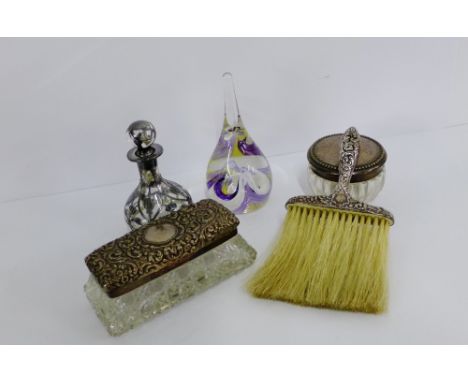 A mixed lot to include a silver topped dressing table jar, small silver handled brush, an art glass paperweight and another t