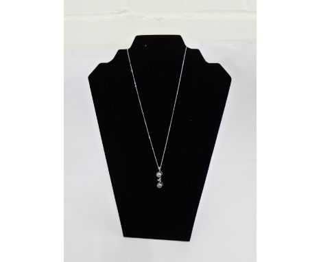 An  18 carat white gold and Tahitian pearl set pendant on 18 carat gold chain  