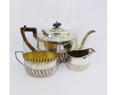 An Edwardian silver half fluted teaset comprising teapot, sugar bowl and milk jug, with makers marks for R&W Sorley, London 1