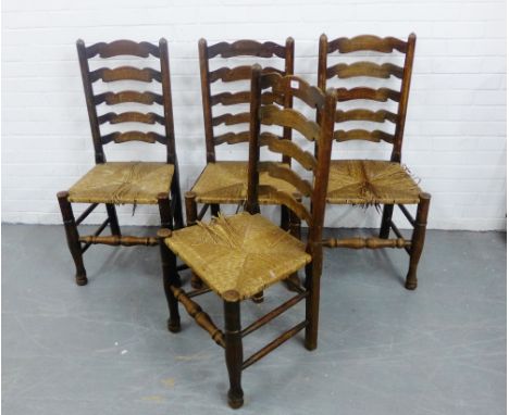 A set of four Lancashire ladder back chairs with rush seats and turned supports and stretchers, 102 x 50cm, (4) 