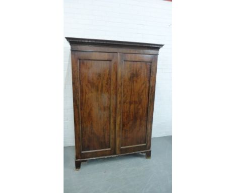 A mahogany two door wardrobe on bracket feet, 184 x 132cm 